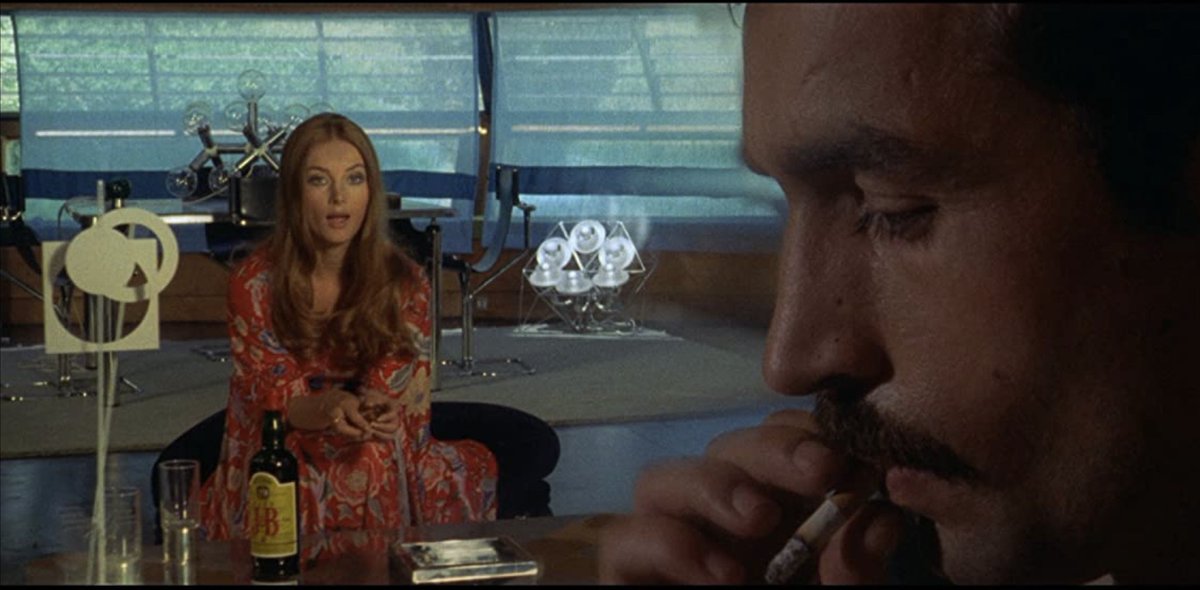 In Don't Torture a Ducking, J&B Rare Scotch Whiskey really got to shine as the lone bottle in this scene with #giallo queen Barbara Bouchet. #horrormovies #JB #horror #70shorror