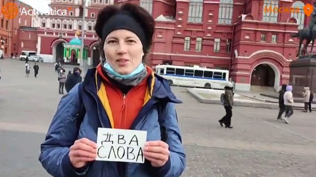 The triumph of Jacobson's metalinguistic function of language: a woman holds a card on which the two words “two words” (два слова) are written, to see whether she will be arrested. Also the victory of pragmatics over semantics: the context provides the entire utterance's meaning.