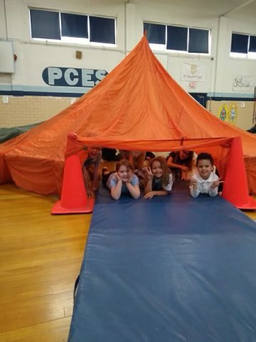 PCScrusaders's tweet image. Our kindergarten, first and second grade students enjoyed the parachute tent with Coach Thompson during gym.