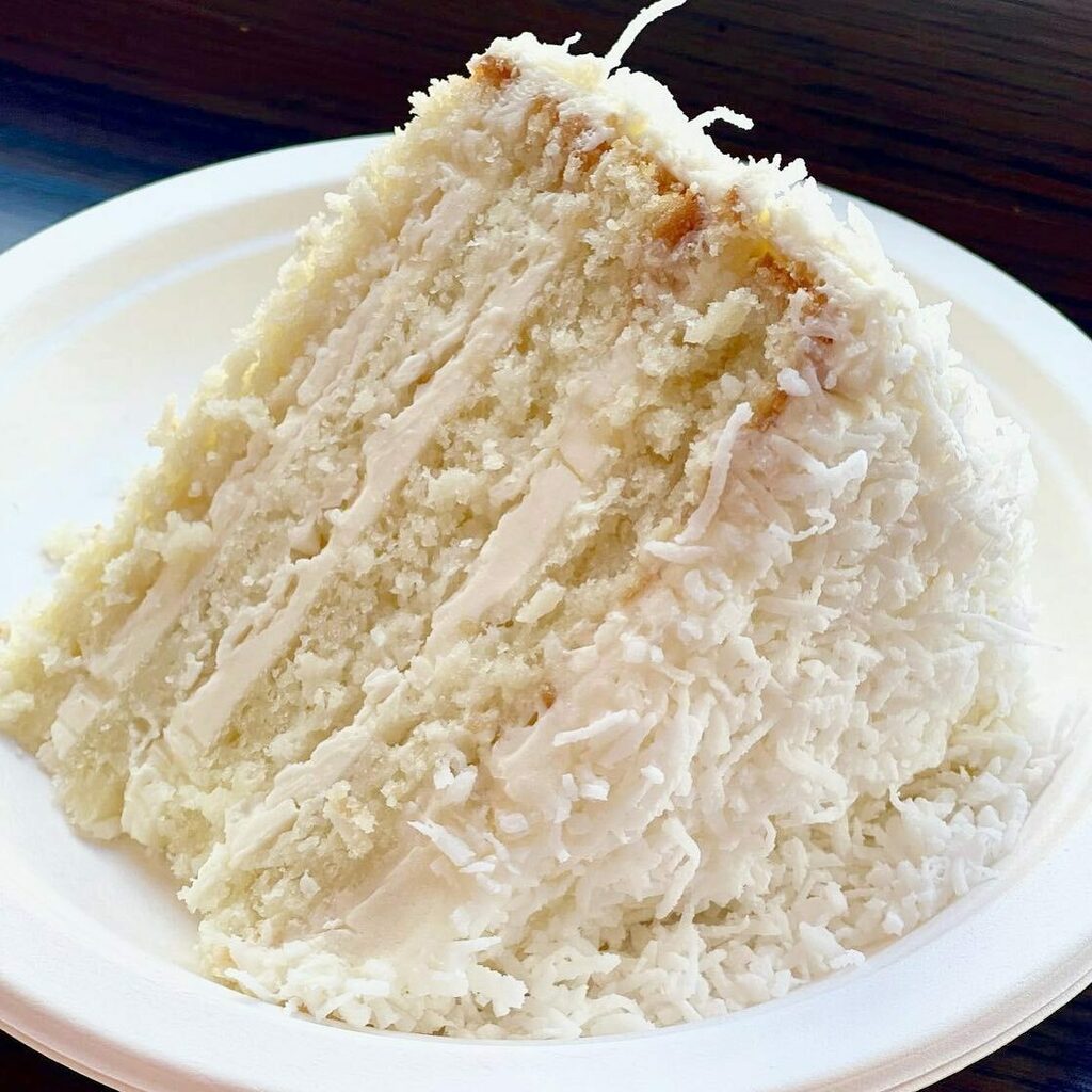 jbchang's tweet photo. Droooooling over this irresistible pic of our 4-layer coconut cake with coconut buttercream shot by @nataliasnacks. Fluffy coconutty and not too sweet. It’s the perfect cake. 🥰🥥🍰🧈🥚🤤#flourbakery #fourlayers #coconut #fluffy #buttery #rich #amazing… https://t.co/zPqSWnl7Wz https://t.co/q4ZeIe7ieP