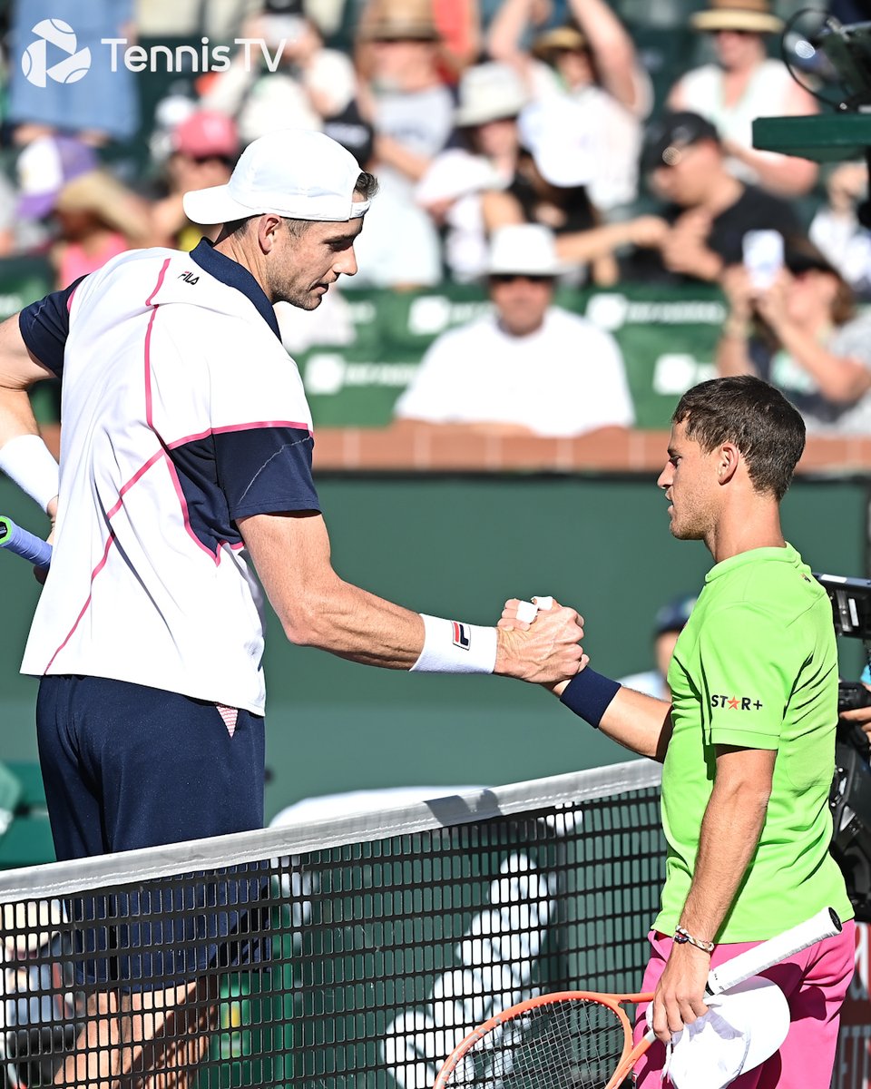 TennisTV's tweet photo. One of tennis' most unique handshakes 😅

@JohnIsner 🤝 @dieschwartzman 

#IndianWells https://t.co/kEq5w8z8FX