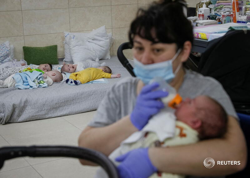 Reuters's tweet image. Ukrainian nurse Oksana Martynenko and her colleagues have 21 babies to look after at a makeshift clinic in a residential basement on the outskirts of Kyiv - all of them surrogates whose parents cannot come to collect them because of the war reut.rs/36pnSsD