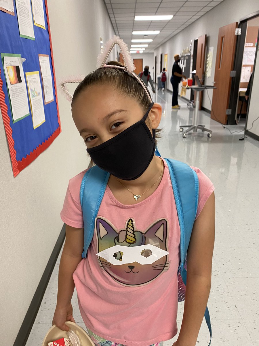 itsMsGuerra's tweet photo. Even Unicorn Kitties are superheroes. Love how this student taped a mask on her shirt 😼🦄 #ReadAcrossAmerica #SuperheroDay #JonesES https://t.co/qM0IHtwRSs