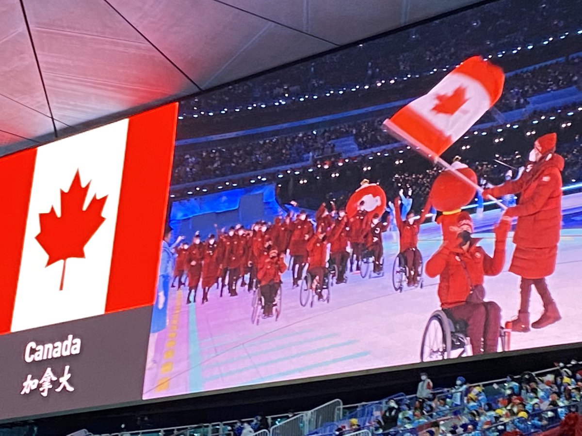 Devin_Heroux's tweet photo. CANADA 🇨🇦 HAS ARRIVED AT THE GAMES

A brilliant sea of red and white has entered the Bird’s Nest. Ina Forrest and Greg Westlake leading the way. 

It marks the first time in Canadian Paralympic history the country has been lead into the Games by two flag bearers. https://t.co/ALP8HhPqpE