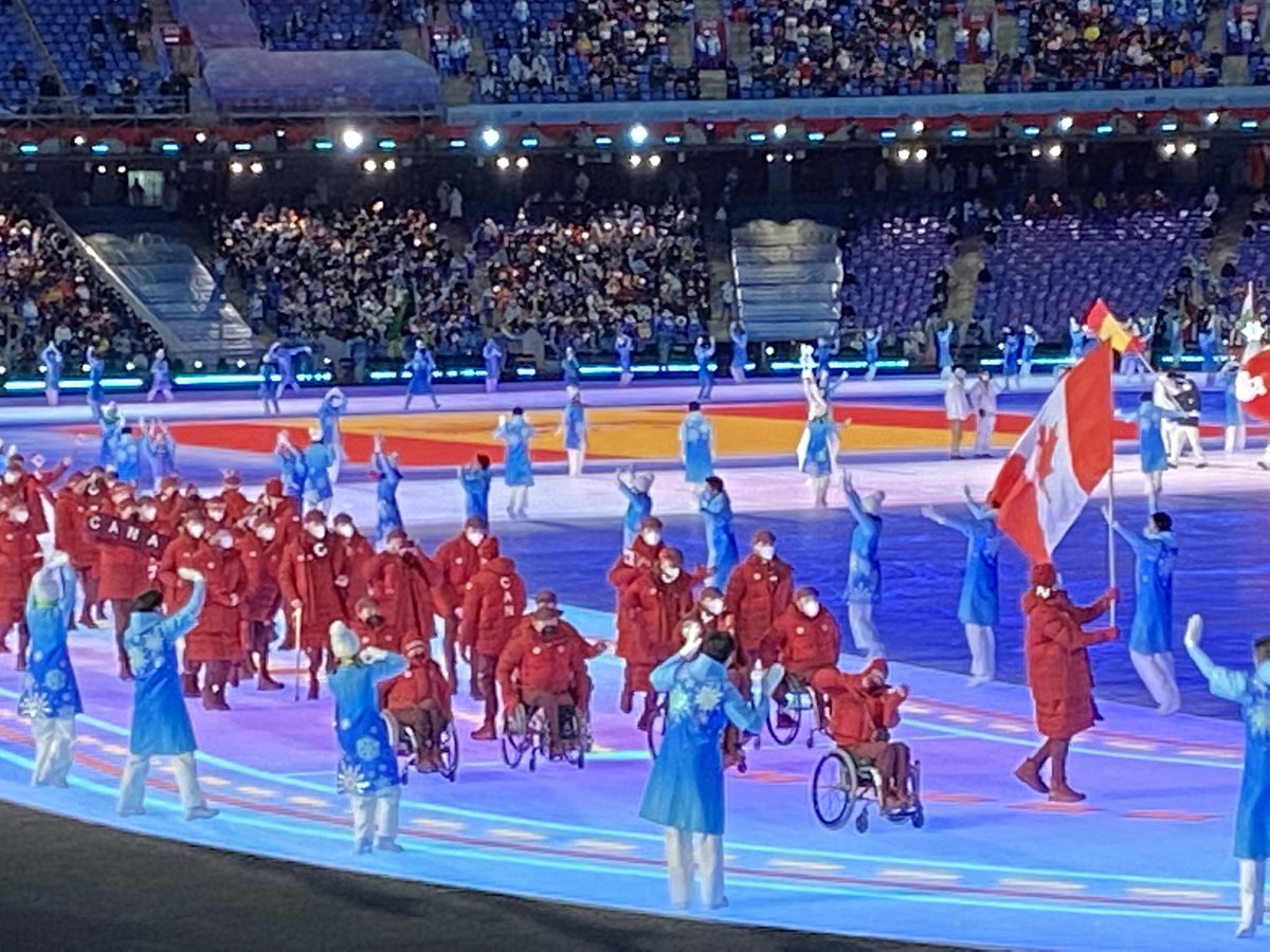 Devin_Heroux's tweet photo. CANADA 🇨🇦 HAS ARRIVED AT THE GAMES

A brilliant sea of red and white has entered the Bird’s Nest. Ina Forrest and Greg Westlake leading the way. 

It marks the first time in Canadian Paralympic history the country has been lead into the Games by two flag bearers. https://t.co/ALP8HhPqpE
