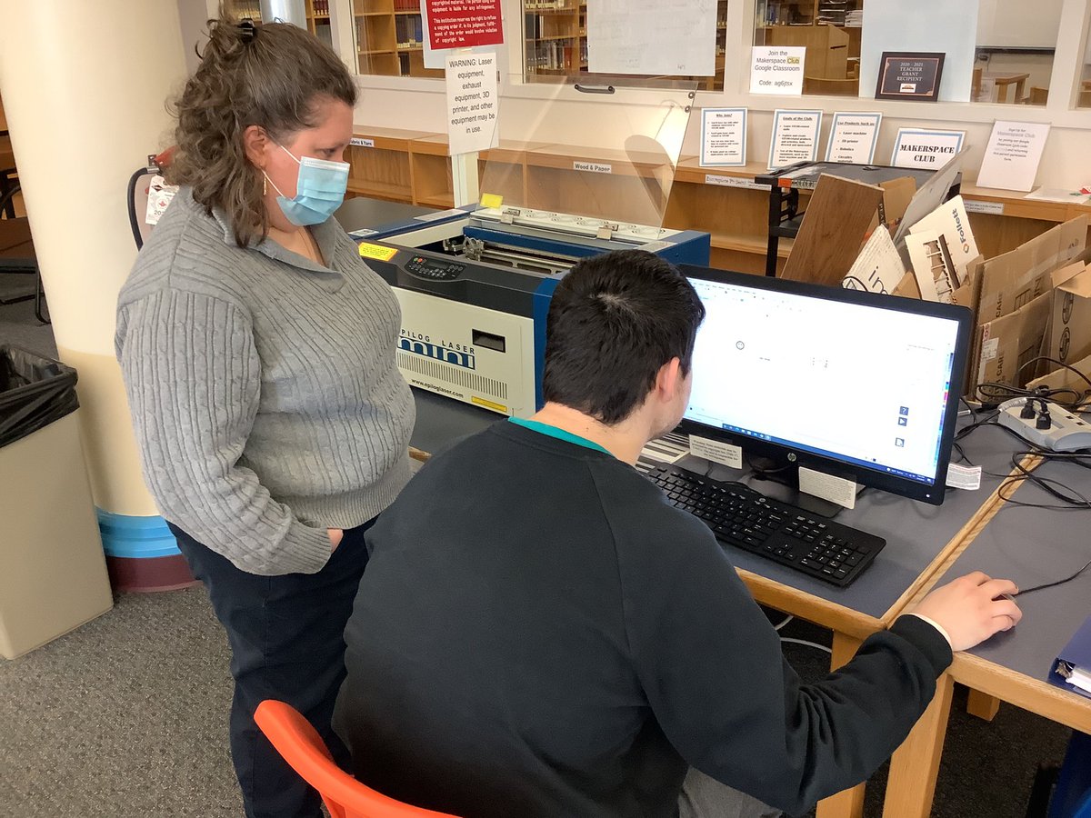 LatrobeHighPost's tweet photo. Mrs. Mamaril assists junior Luke Houle who is creating a project using a laser cutter for the marketing class. https://t.co/gFzCDuBEsU