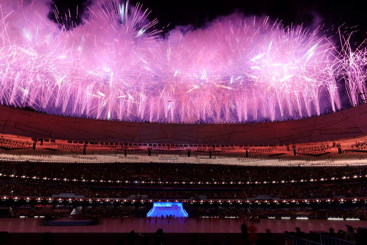 Pink and purple fireworks light up the Beijing sky 