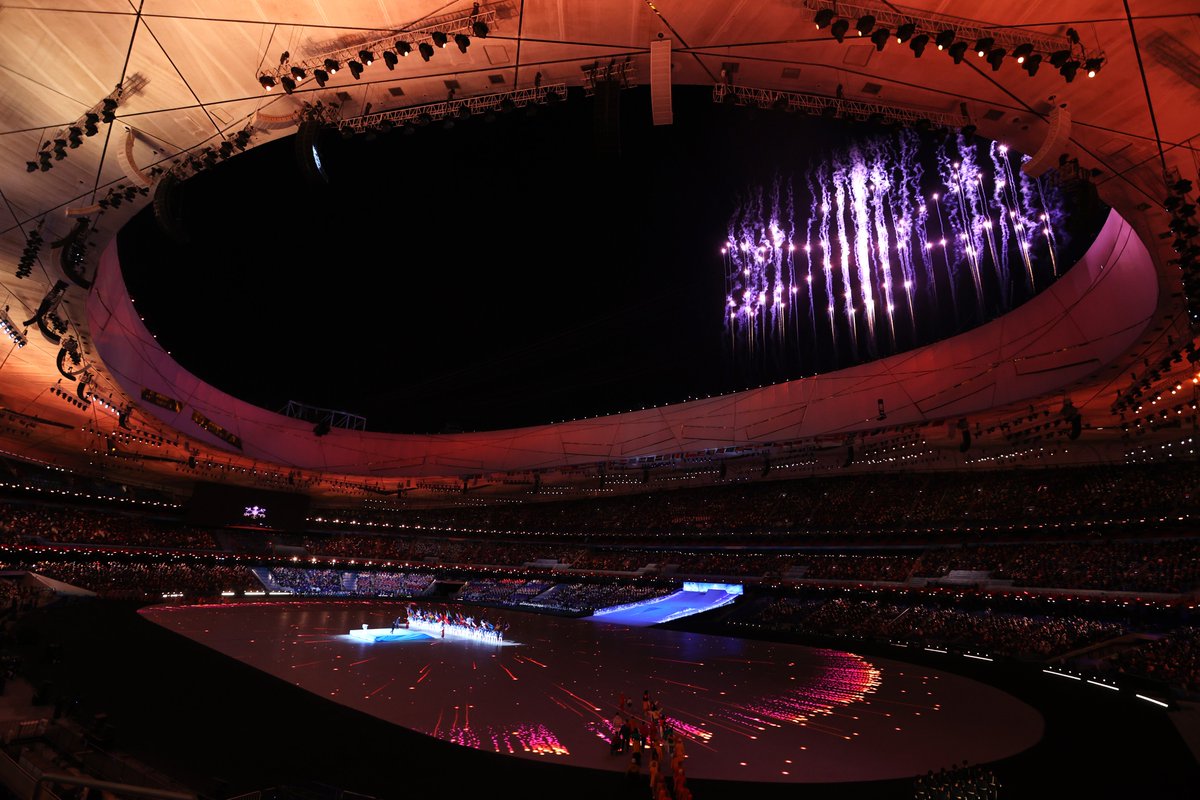 Lights and fireworks explode outside the stadium 