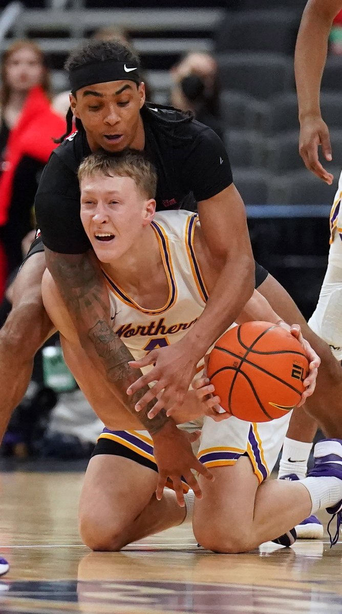 Illinois States' Howard Fleming Jr. surrounds University of Northern Iowa's AJ Green, as both go for the loose basketball in the first half of the Missouri Valley Conference Basketball Tournament at the Enterprise Center in St. Louis on Friday, March 4, 2022.  BILL GREENBLATT/UPI