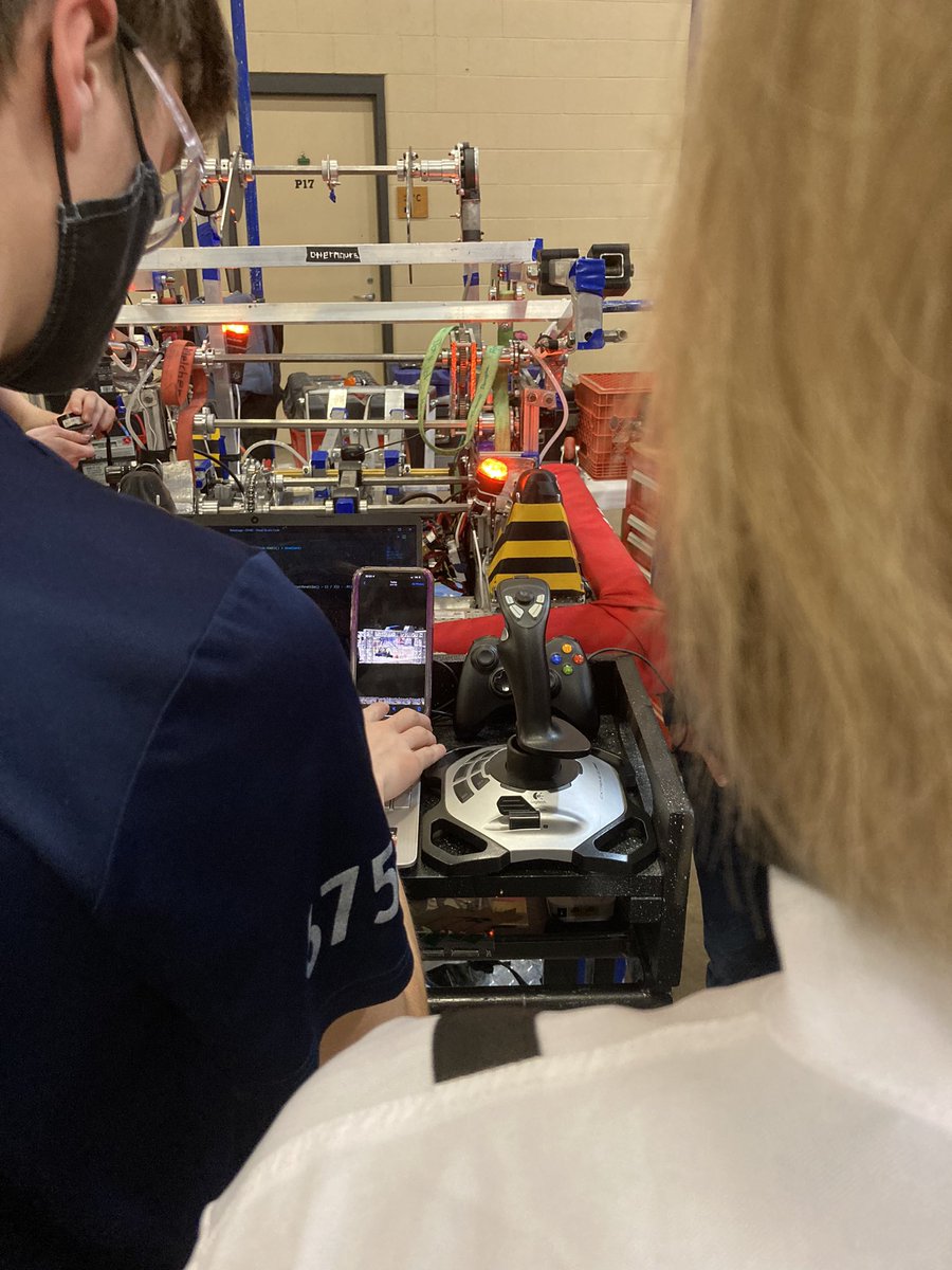 KMRobotics's tweet photo. The team reviewing the footage from the last match, to see what we can do better next time.#otternauts #rapidreacts #northernlightsregional #firstRobotics https://t.co/bCAcZByBtt