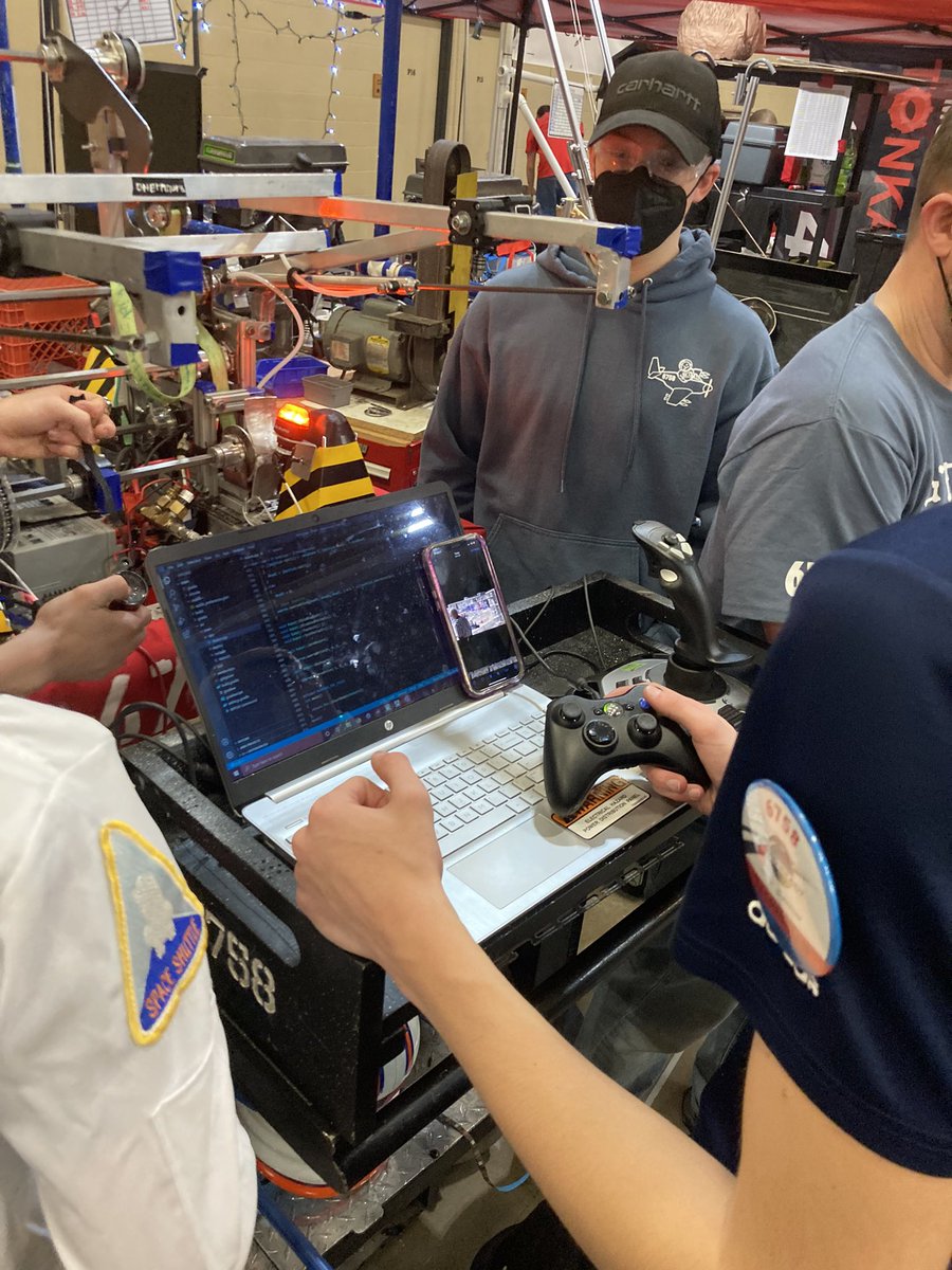 KMRobotics's tweet photo. The team reviewing the footage from the last match, to see what we can do better next time.#otternauts #rapidreacts #northernlightsregional #firstRobotics https://t.co/bCAcZByBtt