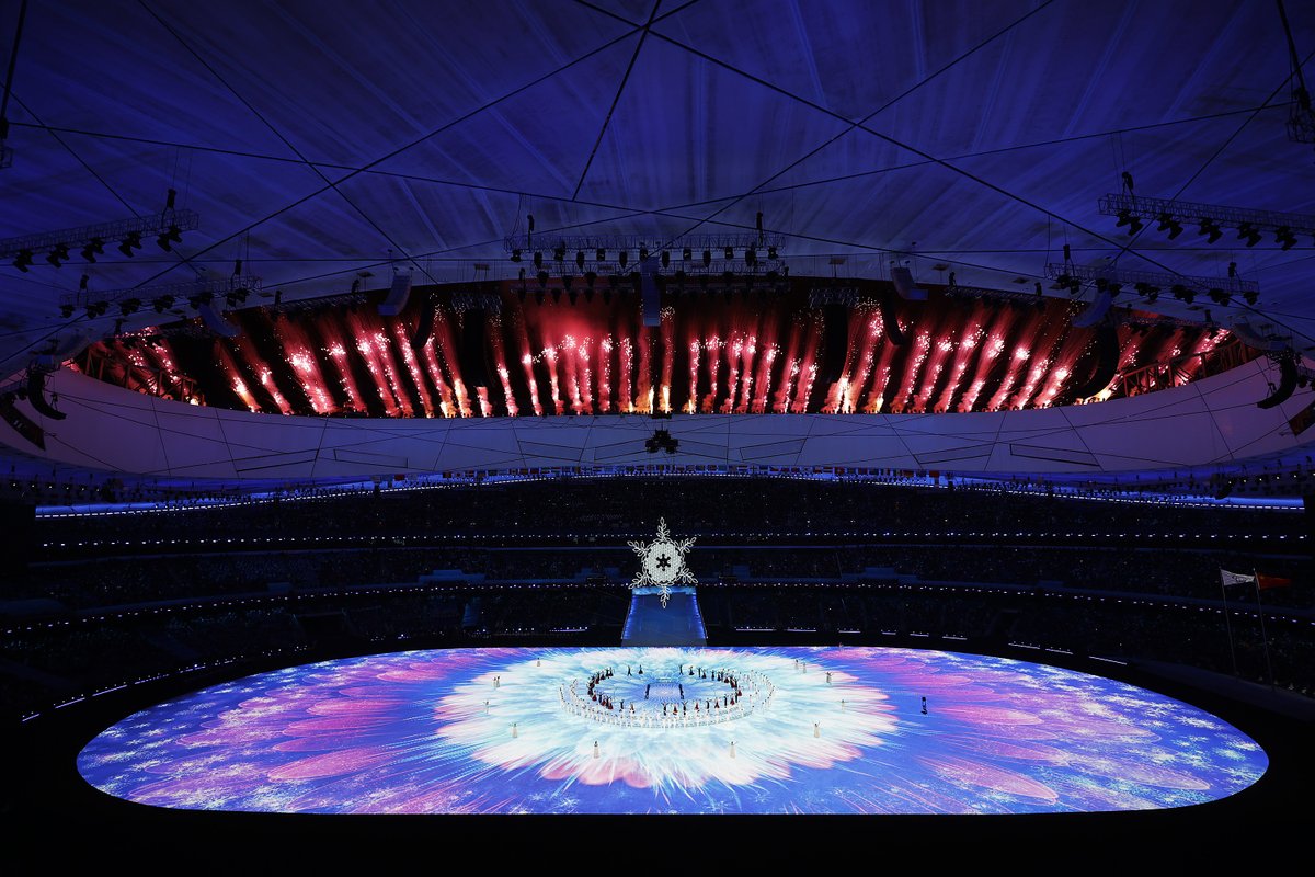Fireworks light up the Bird's Nest Stadium with the flame alight in the cauldron