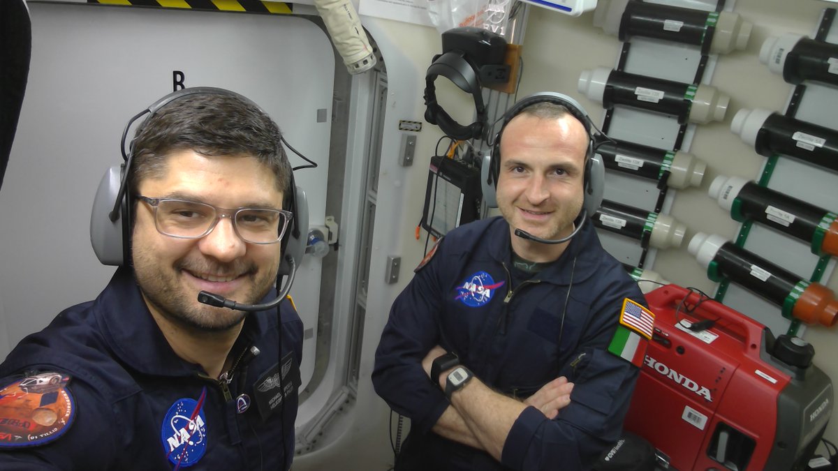 NASAExpeditions's tweet photo. Houston, we hear you!

HERA crew members Dragos Popescu &amp; Pietro Di Tillio don headsets in their Earth-based analog to talk to ground control. There’s a catch: Messages travel with ~ 5-min delays. This helps @NASA learn how future crew may adapt to the remoteness of deep space. https://t.co/FWJBHFuGyN