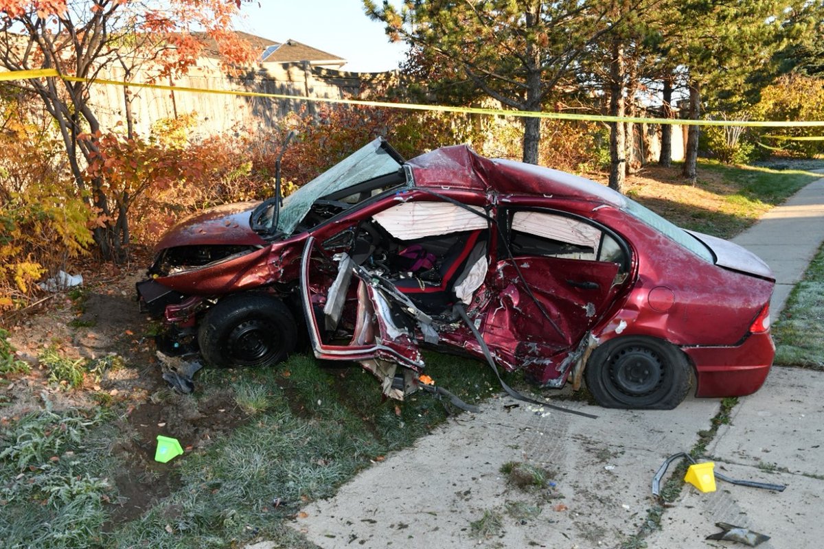 Severely damaged red car