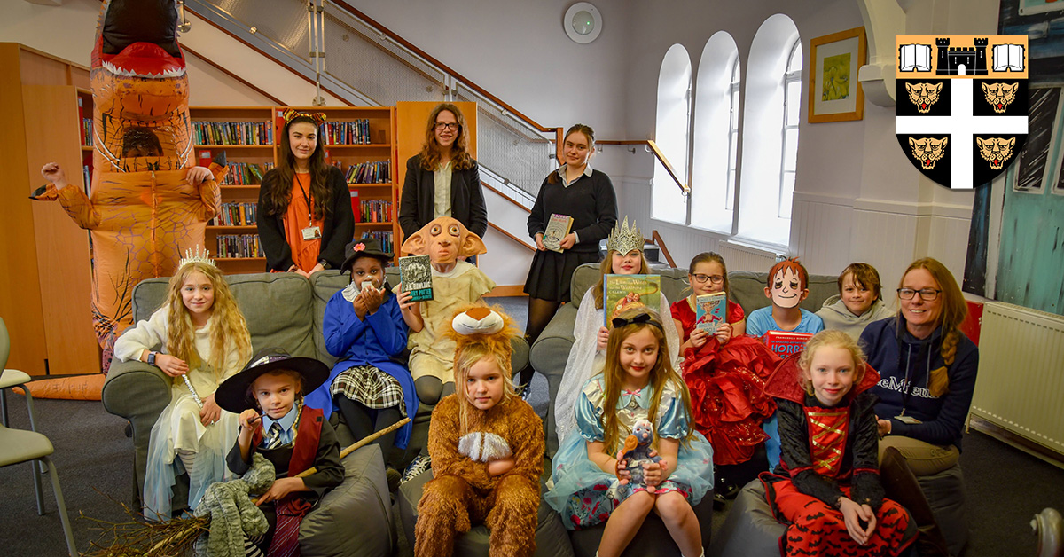 DoverPrep's tweet photo. Our Prep School classes were treated to their own story time sessions in the Senior School library yesterday, with pupils from Fourth Form and the Sixth Form reading to them. This was just one of the many activities the College put on to celebrate @WorldBookDayUK. https://t.co/kex5SOmSvY
