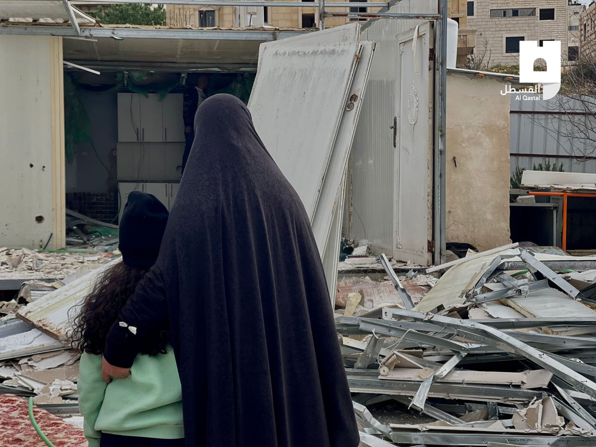 OnlinePalEng's tweet photo. Members of the Palestinian Shweiki family helplessly standing on the rubble of their home in Beit Hanina in occupied Jerusalem after they were forced to demolish it by Israeli municipality to avoid paying exorbitant costs if the municipality carries out the demolition on its own. https://t.co/pswGfQJzFA