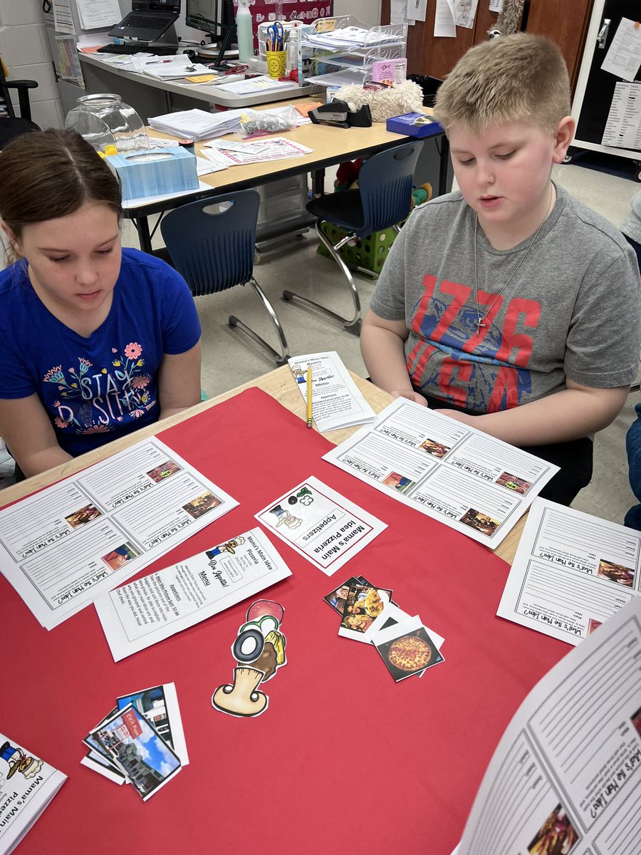 BES_ElemLeader's tweet photo. Mrs. Thompson’s class diving into a fun main idea and text feature review lesson!🍕 #4thGrade #ELA #FalconPride https://t.co/PmHmR27pfJ
