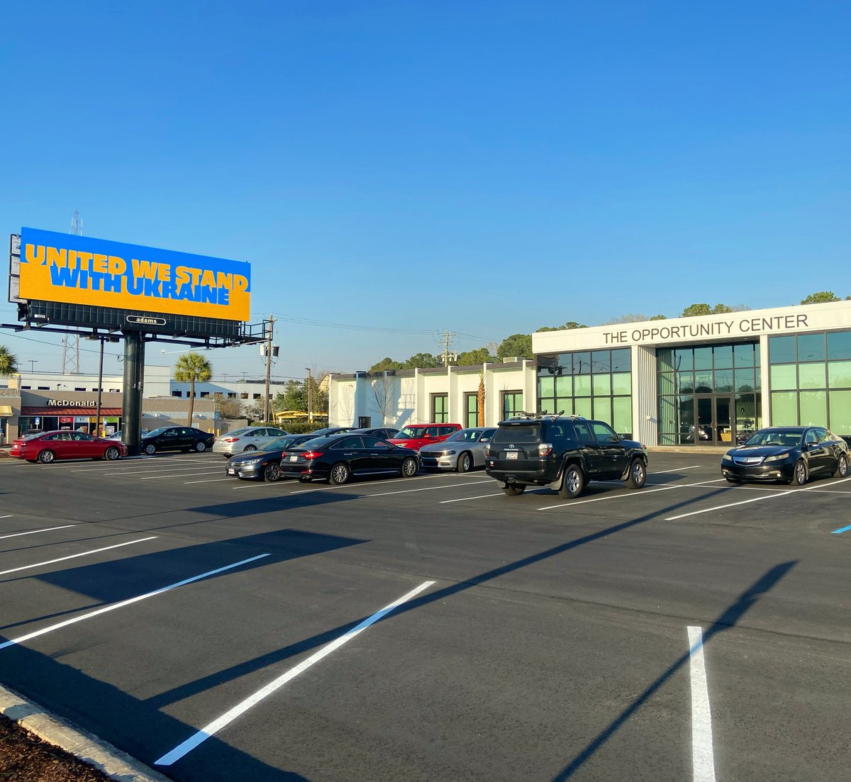 Beautiful evening last night.  This photo shows the exterior of our new home, The Opportunity Center.  Shout out to our friends at <a href="/AdamsOutdoor/">Adams Outdoor Adv.</a> for the neighboring billboard, United We Stand With Ukraine.
#heirsproperty #OpportunityCenter