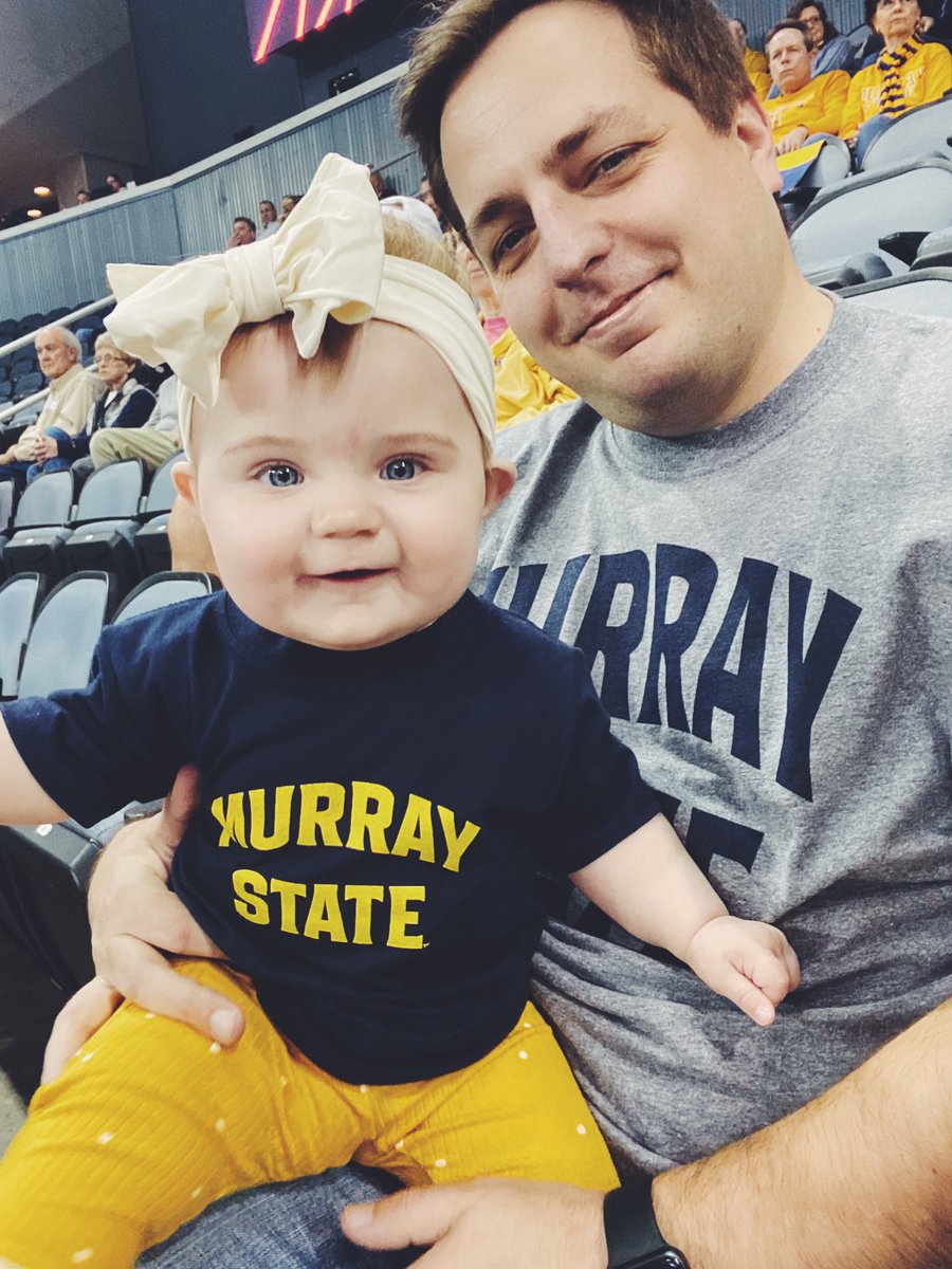Jess_Lovett's tweet photo. Cam’s first OVC tournament! She loved cheering on uncle Wyatt and the Lady Racers 🤍💙💛 @CoachTomFoust @MSUCoachFoust https://t.co/xDwa0hWZpk