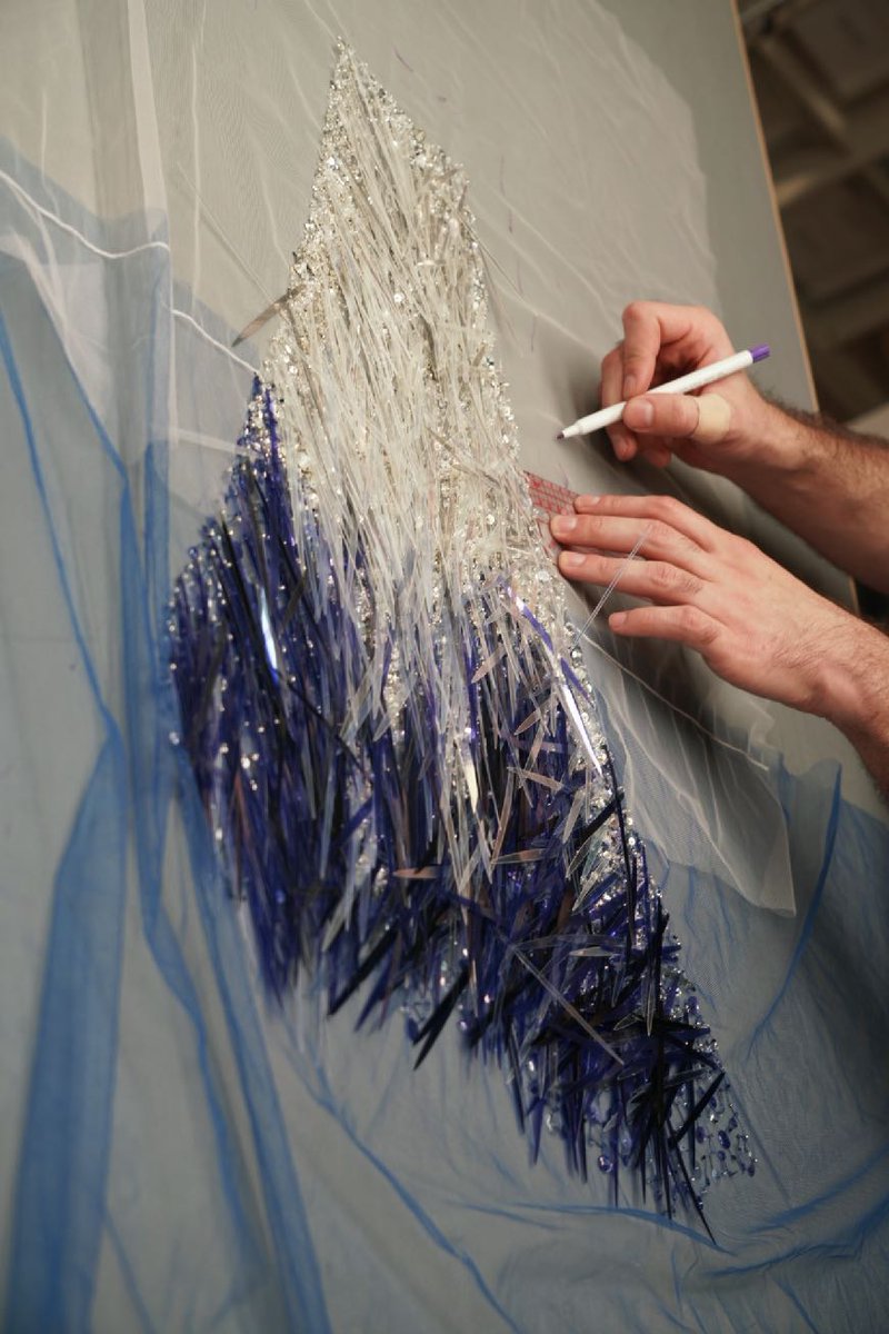 McQueen's tweet photo. In progress: developing the dégradé blue sky crystal and sequin shard rain embroidery of the #McQueenSS22 trompe l’oeil tank dress.

Photographed by Ruby Pluhar. https://t.co/n4lkUxwbCs