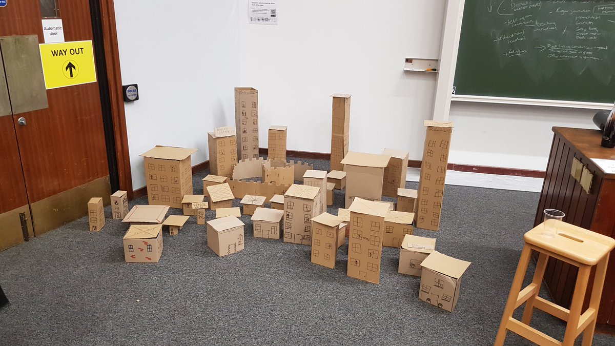 We've built a cardboard city for you to destroy. It will be violent. It is for charity. Come on by to destroy everything.