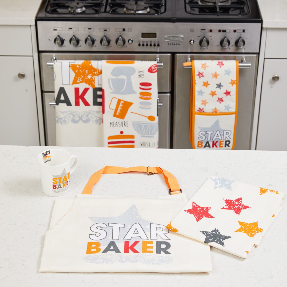 CRUKShops's tweet photo. Who’s the #StarBaker in your life? Help them look the part with our new The Great @SU2CUK Bake Off merch! Browse the range: https://t.co/lHmdAZkkBd https://t.co/WJxgrAbyGl