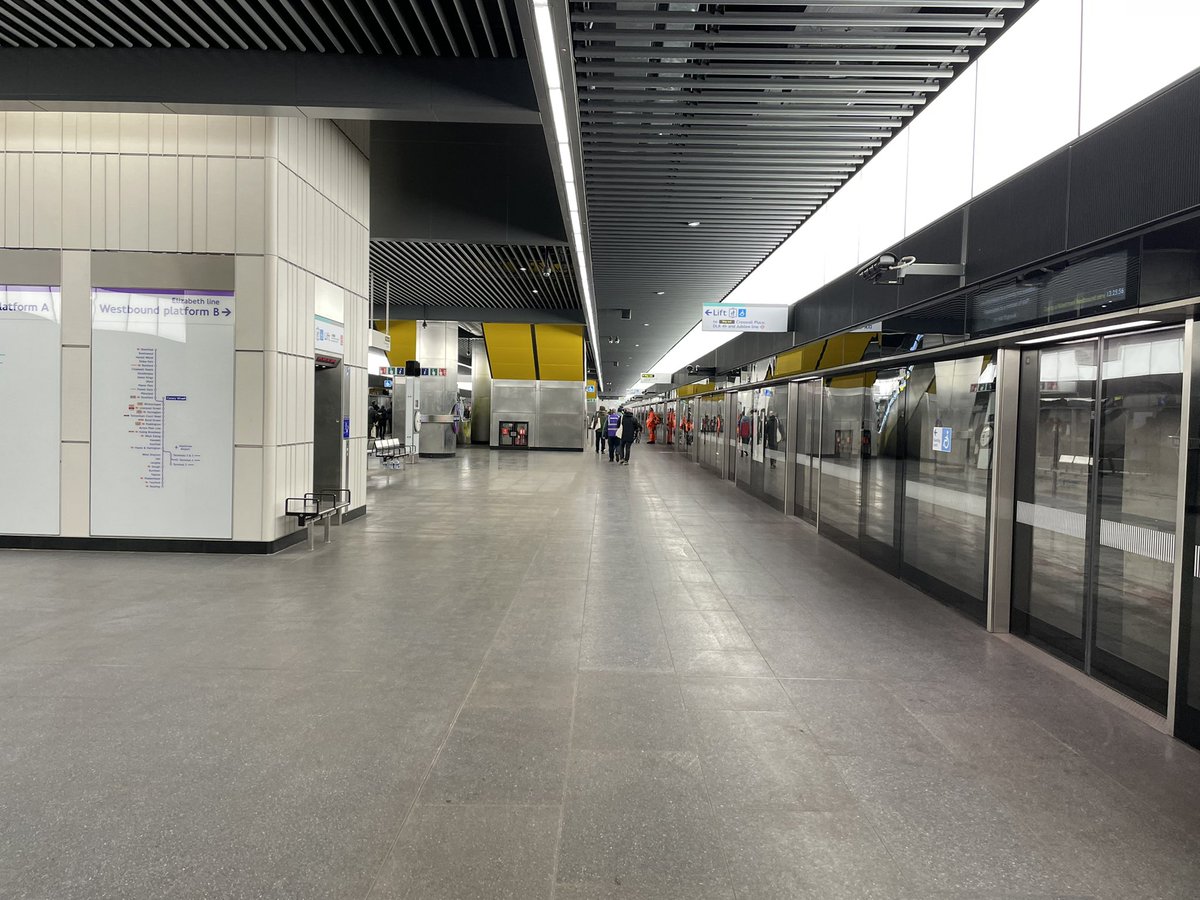 SimonZev's tweet photo. After, a little longer than planned, our rescue train was able to move up to Canary Wharf for us to alight. Here’s the “first” completed Crossrail station with its funny yellow escalators (amongst other things of which we don’t speak 🤐. #TrialOps https://t.co/FA9C83lz8o