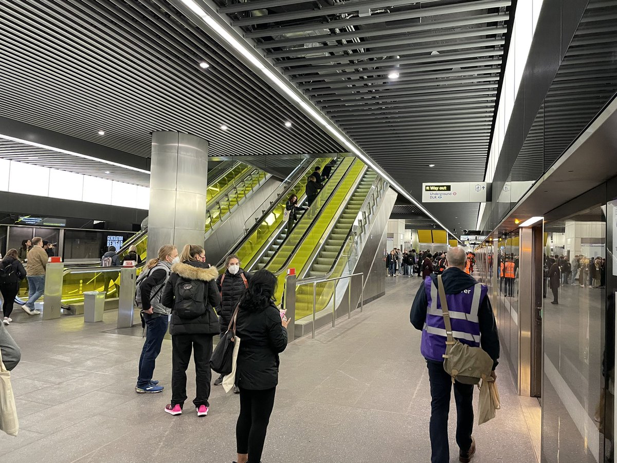 SimonZev's tweet photo. After, a little longer than planned, our rescue train was able to move up to Canary Wharf for us to alight. Here’s the “first” completed Crossrail station with its funny yellow escalators (amongst other things of which we don’t speak 🤐. #TrialOps https://t.co/FA9C83lz8o