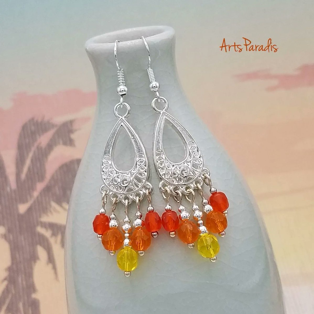 “I recently did a challenge in my VIP group where I would make designs based off of submitted pictures. Someone shared an amazing sunset. And it inspired these chandelier earrings. I can definitely see a sunset, can't you?”