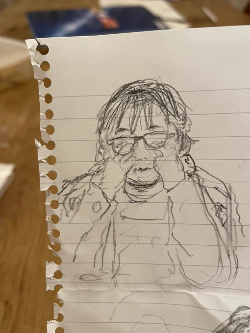 花粉症のため目がかゆい夫。長女画。 