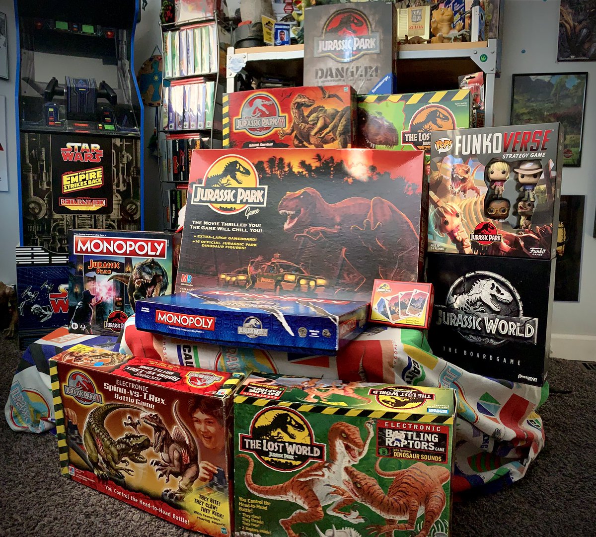 BrentKappel's tweet photo. Whose ready for game night? Seeing the posts about Legacy of Isla Nublar got me thinking about all the great Jurassic Board Games we’ve had over the years. Anyone have a favorite? #JurassicWorld #JurassicPark #monoploy #Funko #ravensburger #ThatsJurassic https://t.co/UkGp1bq7V2