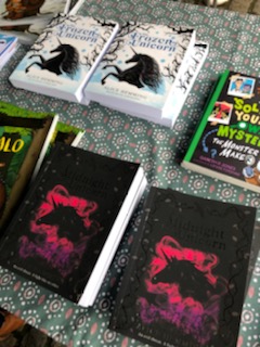 AliceHemming1's tweet photo. Some more pics from today's #Hitchin #WorldBookDay event @nextpagebooksUK. The March winds were in full force but the tent was full of enthusiastic budding authors and book cover designers. Well done all! https://t.co/I5BYW1U20m
