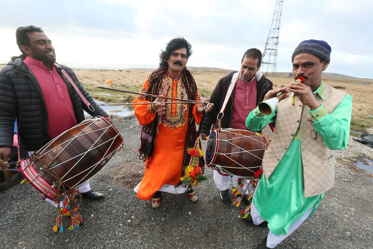 PhilTaylorARPS's tweet photo. This is bonkers. I'm stopped on a car park having photographed the mast in the background. These guys hop out of their car and onsist on staging an impromptu performance for me. The guy in the middle is famous for playing #Chimta #Oldhan #Asisn @snapperjim @DannyCrompton1 https://t.co/OM4VWUBTKj