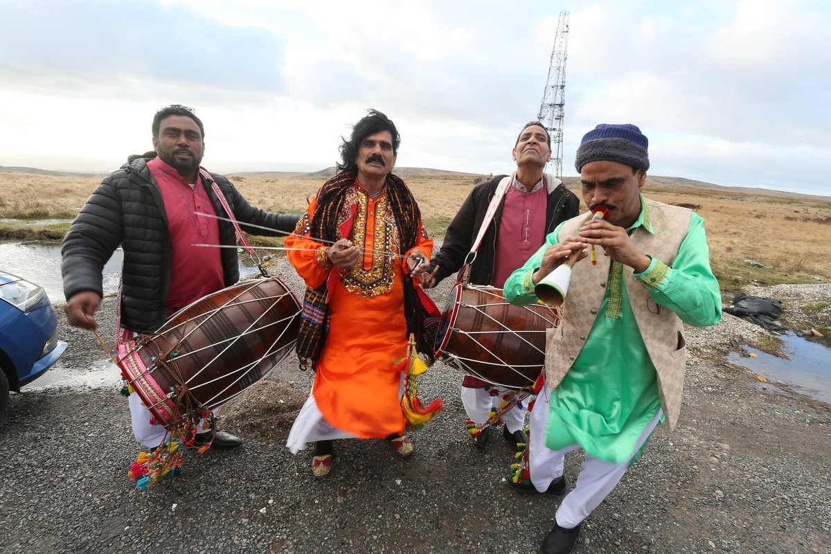 PhilTaylorARPS's tweet photo. This is bonkers. I'm stopped on a car park having photographed the mast in the background. These guys hop out of their car and onsist on staging an impromptu performance for me. The guy in the middle is famous for playing #Chimta #Oldhan #Asisn @snapperjim @DannyCrompton1 https://t.co/OM4VWUBTKj