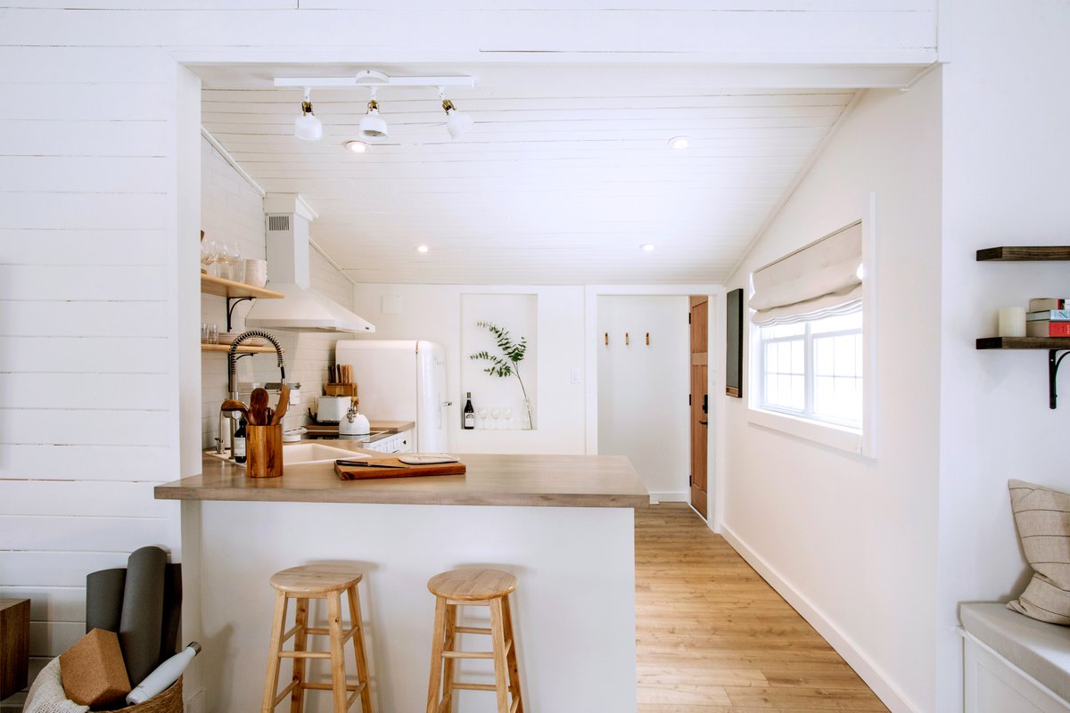 An open kitchen and breakfast bar at The Hideaway. Many say the kitchen is the heart of a home, so we designed ours bright and in the middle of everything. 🤍