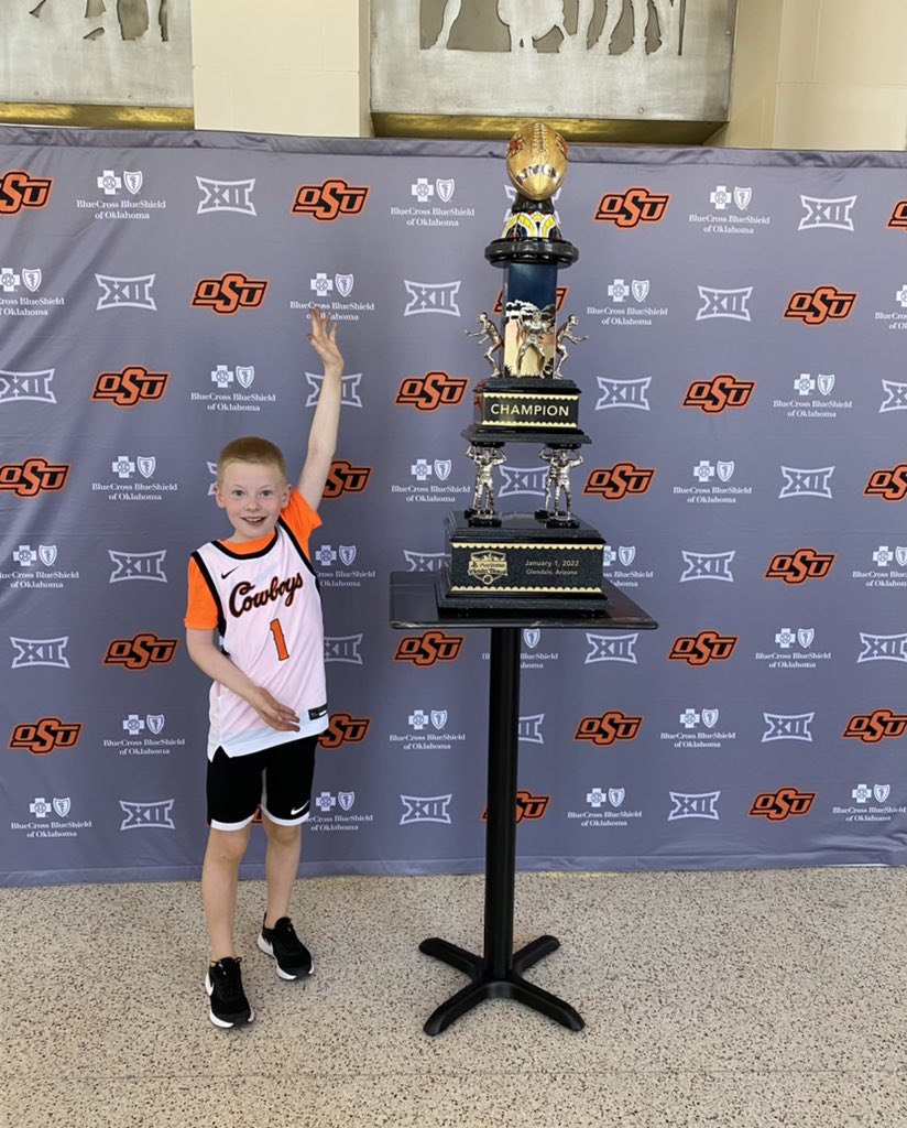 cara_ferrell's tweet photo. Cowboy basketball and the Fiesta Bowl trophy! #GoPokes #okstate https://t.co/JKu4IVOa30
