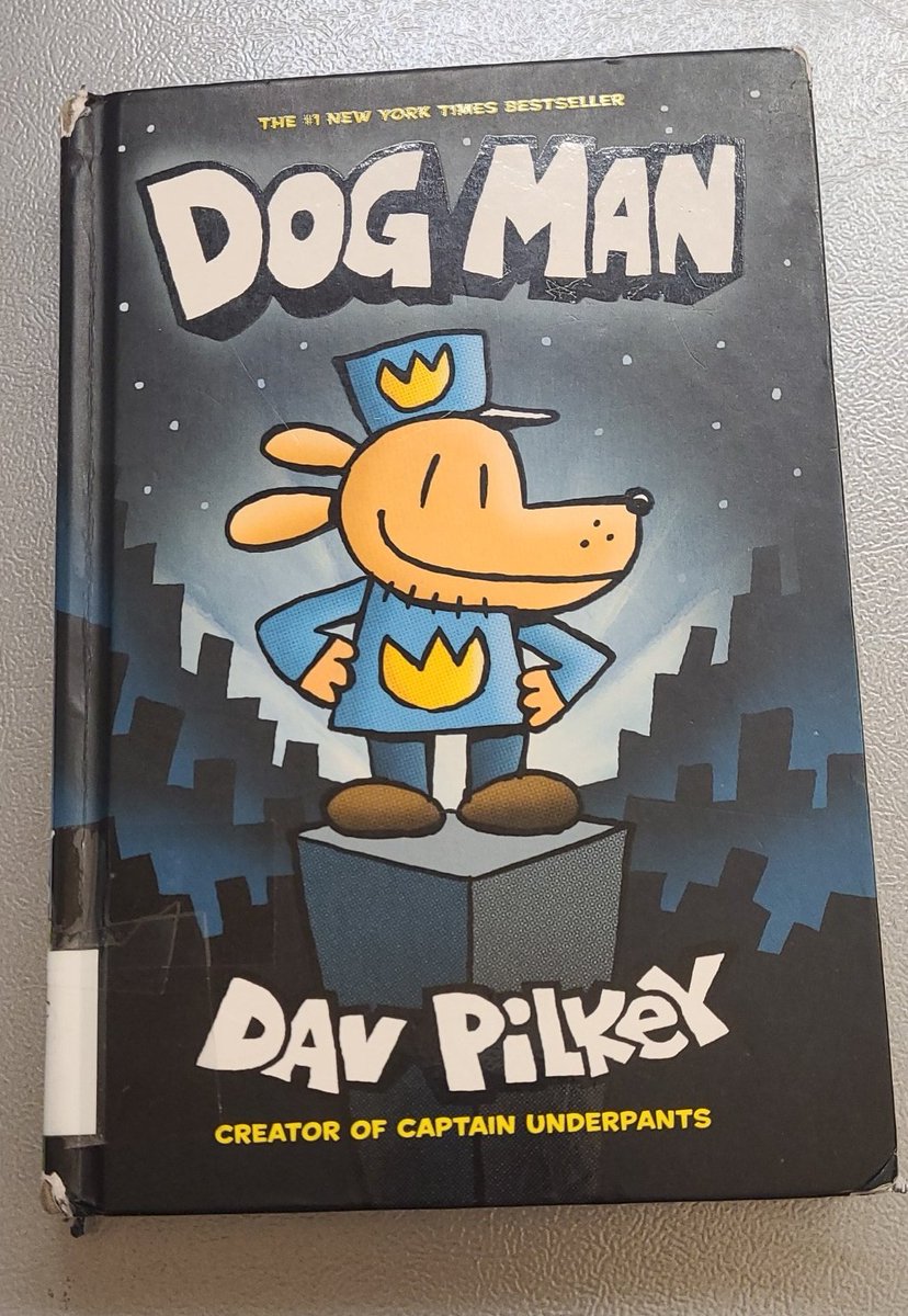 Working a Saturday at the #library and reading a classic in my "spare time"--- #DogMan #YSLibrarian #librarylife
