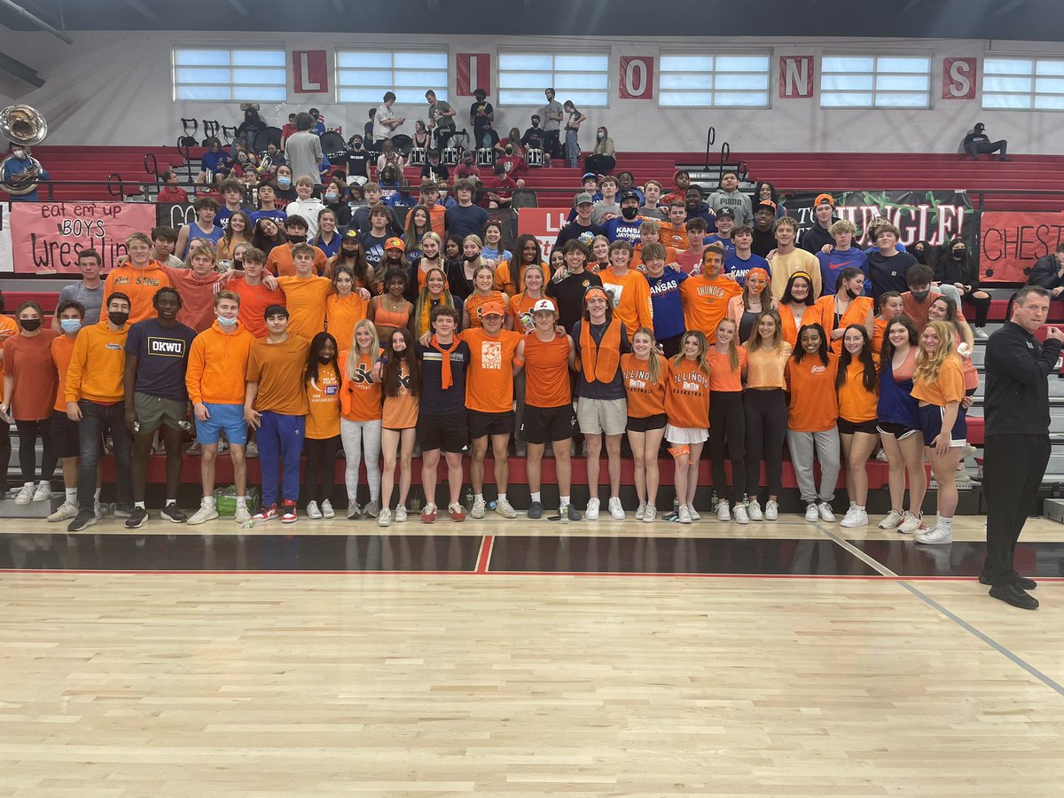 lhsbudget's tweet photo. The Lawrence High student section themed their final home boys basketball game “Orange and Navy” in solidarity with the Olathe East community following yesterday’s attack. https://t.co/yFZSNs7PvG