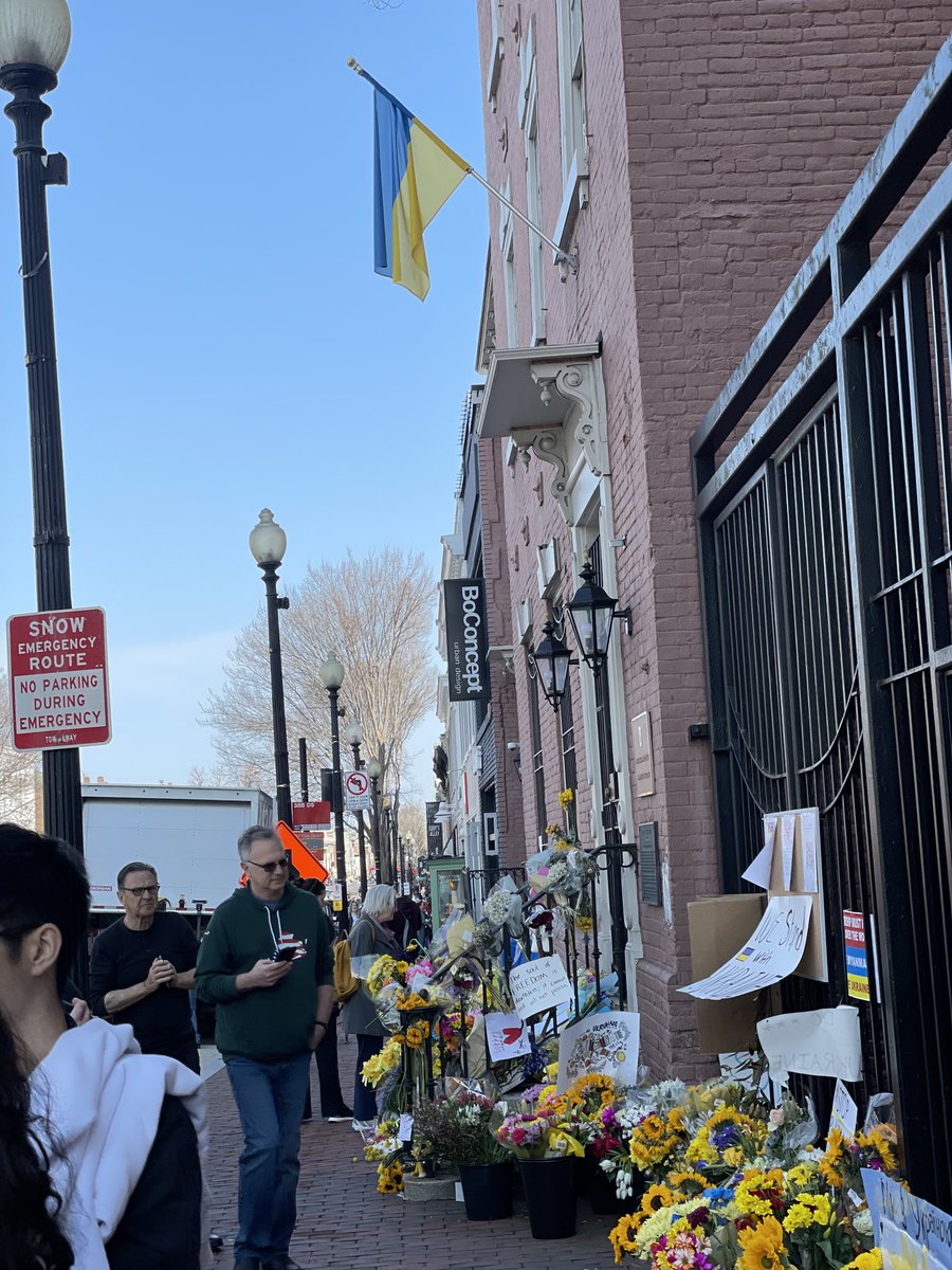 Lantelme_Jim's tweet photo. At the Ukrainian embassy in Georgetown. Bouquets, flags and well-wishers. #keepukrainefree https://t.co/UuFgl92MAM