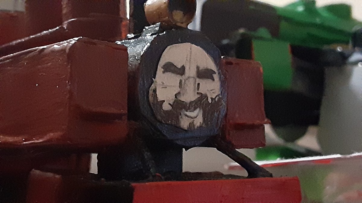 216. Stanley wore black in service originally, however once restored he wore a more maroon color