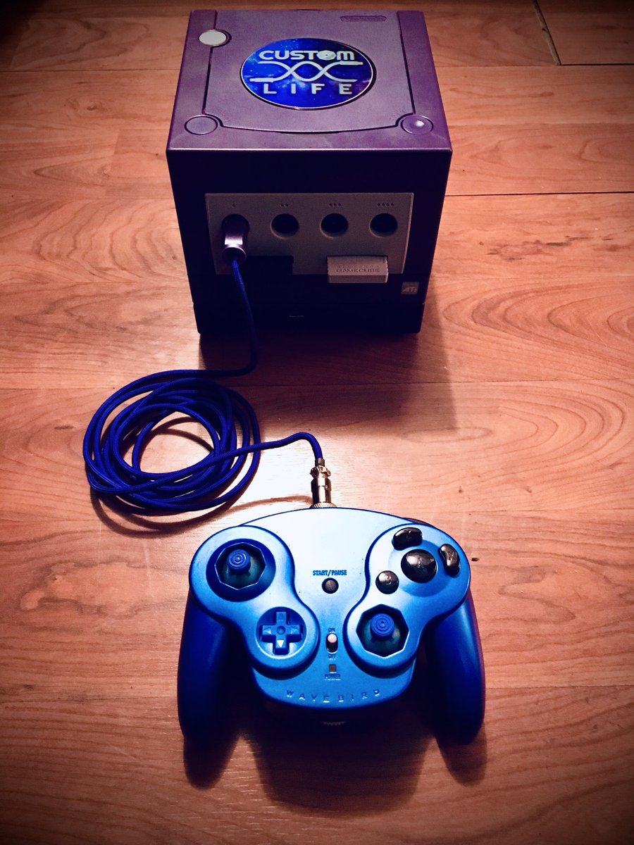 Max_Hoyt's tweet photo. So I had the idea to put a T3 in a wavebird shell for the more ergonomic grip. Eventually I ended up with this beauty:

The Crystal Mountain Bluebird! 

Big thanks to:

@LevCustoms for the sticks!
@HiraGCC for the buttons!

And ESPECIALLY @CGCC_Life for the construction &amp; paint! https://t.co/IhpVqy003C