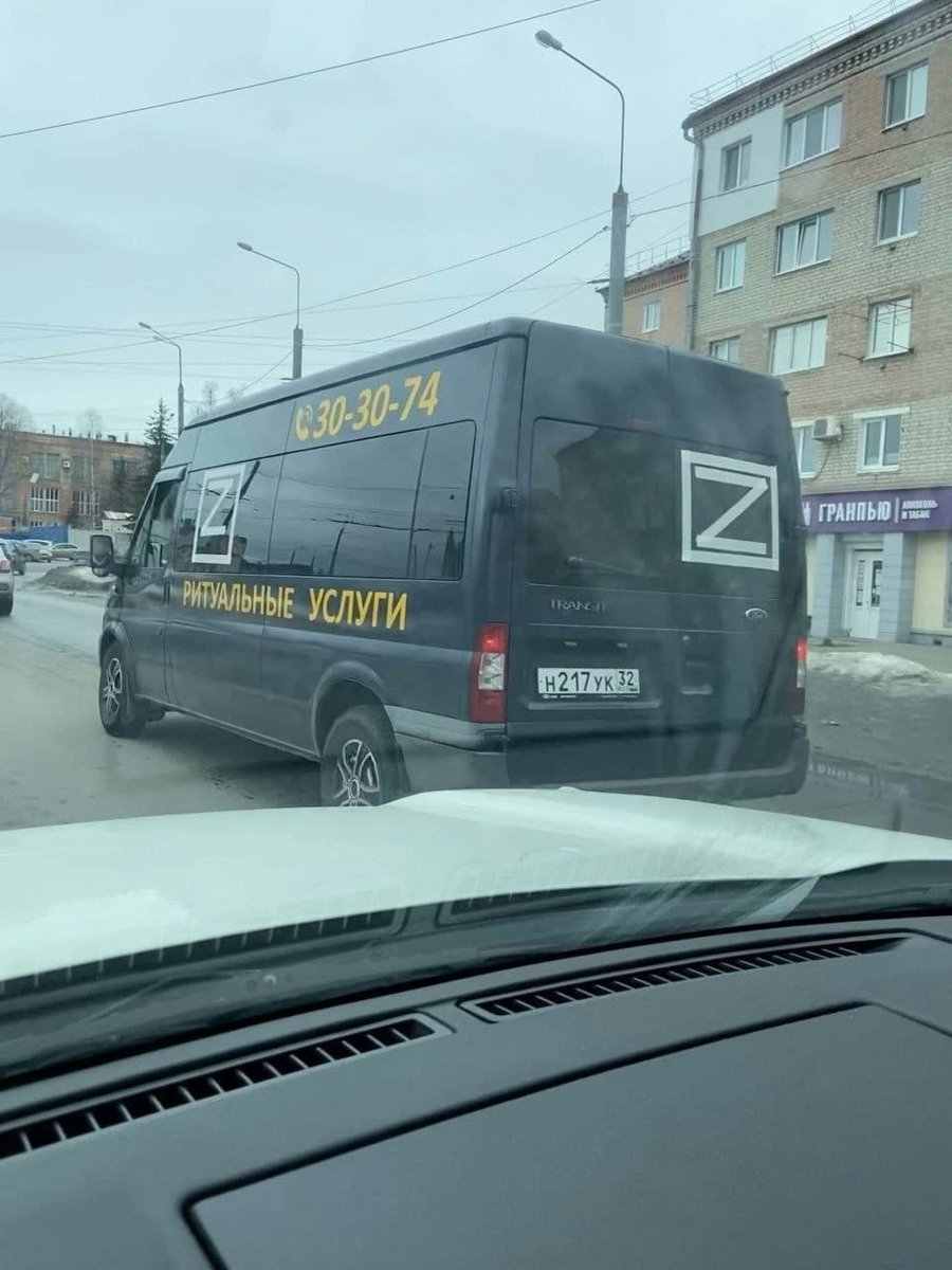 Business owners put "Z" - showing their support of invasion on their trucks. Here you see a funeral service fully endorsing Z message