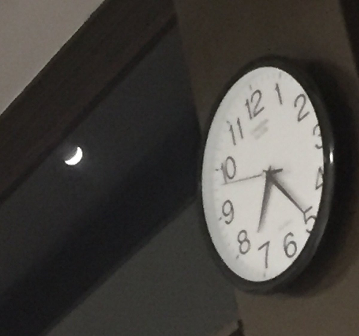 Fuzzy new moon and the clock in my ward tonight