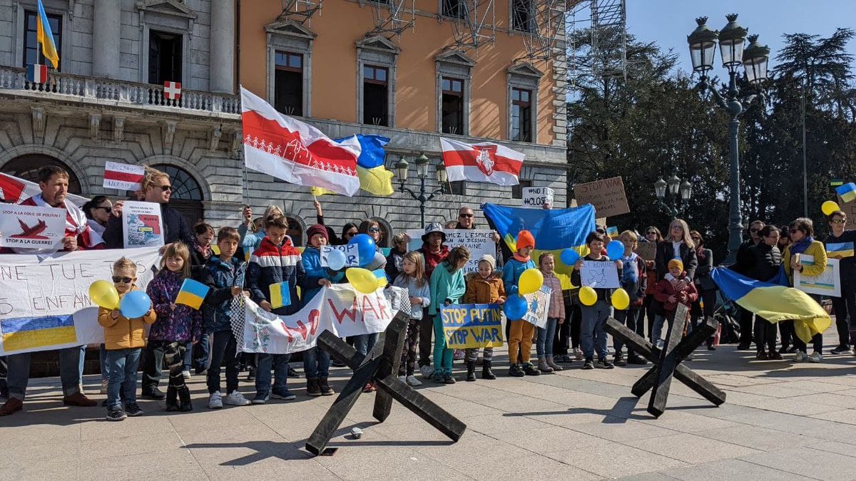 Tsihanouskaya's tweet photo. The Belarusian diaspora continues to hold actions of solidarity with Ukrainians – in 🇧🇪🇬🇪🇩🇪🇵🇱🇷🇸🇫🇷, and many other countries. We don't want this war. We don't want any missiles &amp; military aircraft launched from the territory of our homeland. We #StandWithUkraine. https://t.co/eYULK8VVbv