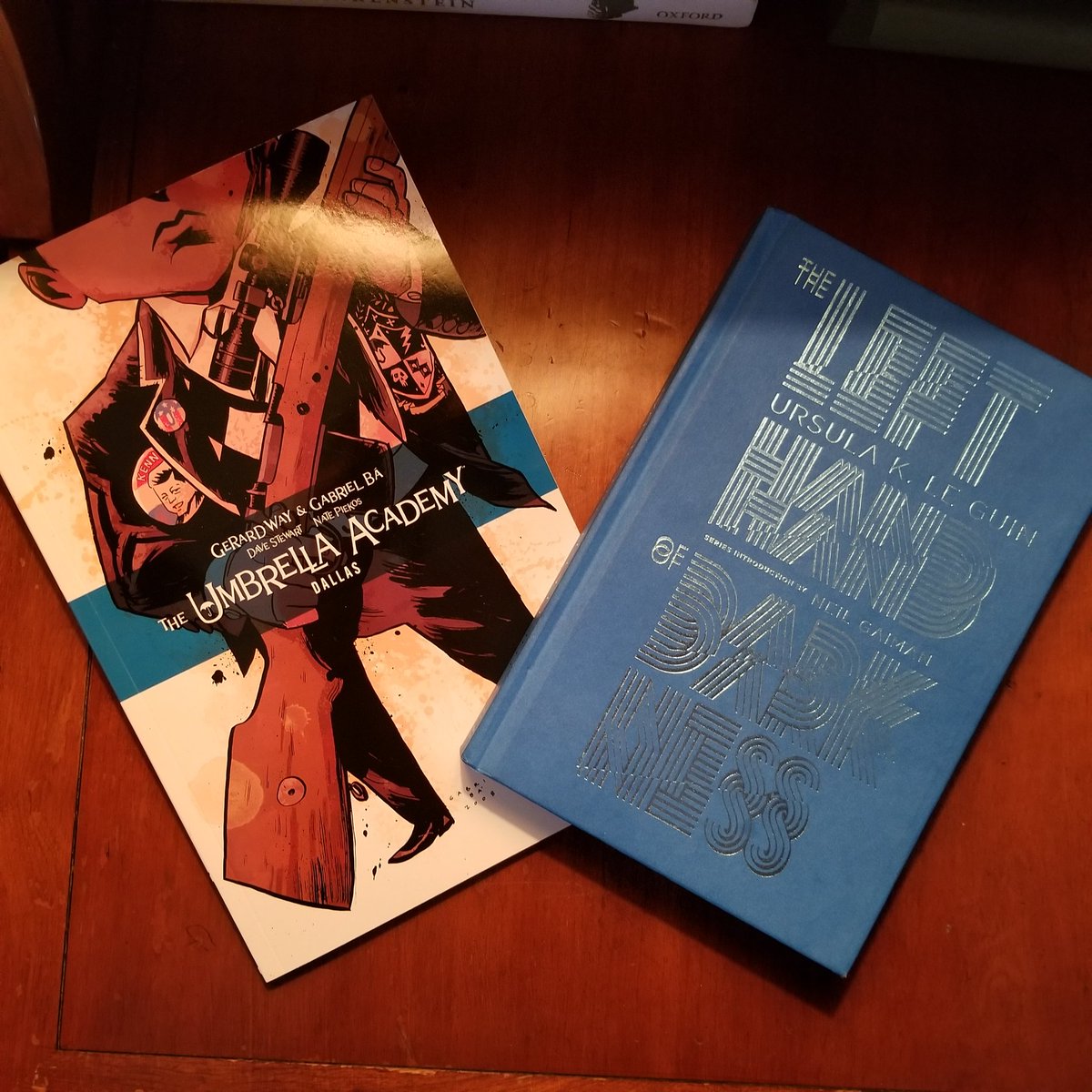 EBKfromLA's tweet photo. What I'm currently reading, and 'oh man!' is one of them really pertinent to today's climate (maybe both?). What's everyone else been reading? #lefthandofdarkness #Umbrellaacademy #NoWar #endoftheworld https://t.co/NEs9KitP9d