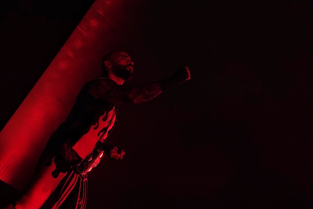 WWE's tweet photo. .@KingRicochet’s entrance hits different with the #ICTitle around his waist!! #WWEMontreal https://t.co/Hz0VOY6GXD