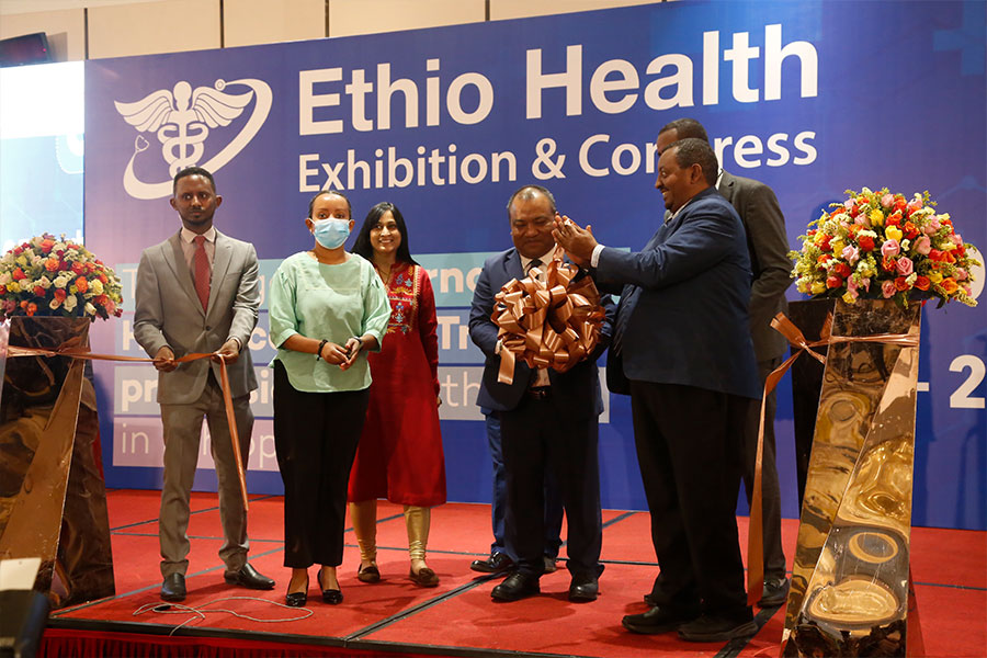 HEALTH EXHIBIT: Melaku Ezezew (right), president of the #Ethiopia|n Chamber of Commerce &amp; Sectoral Associations, and Shri Robert Shetkintong (center), ambassador of India, at the opening of the Ethio Health Exhibition &amp; Congress.