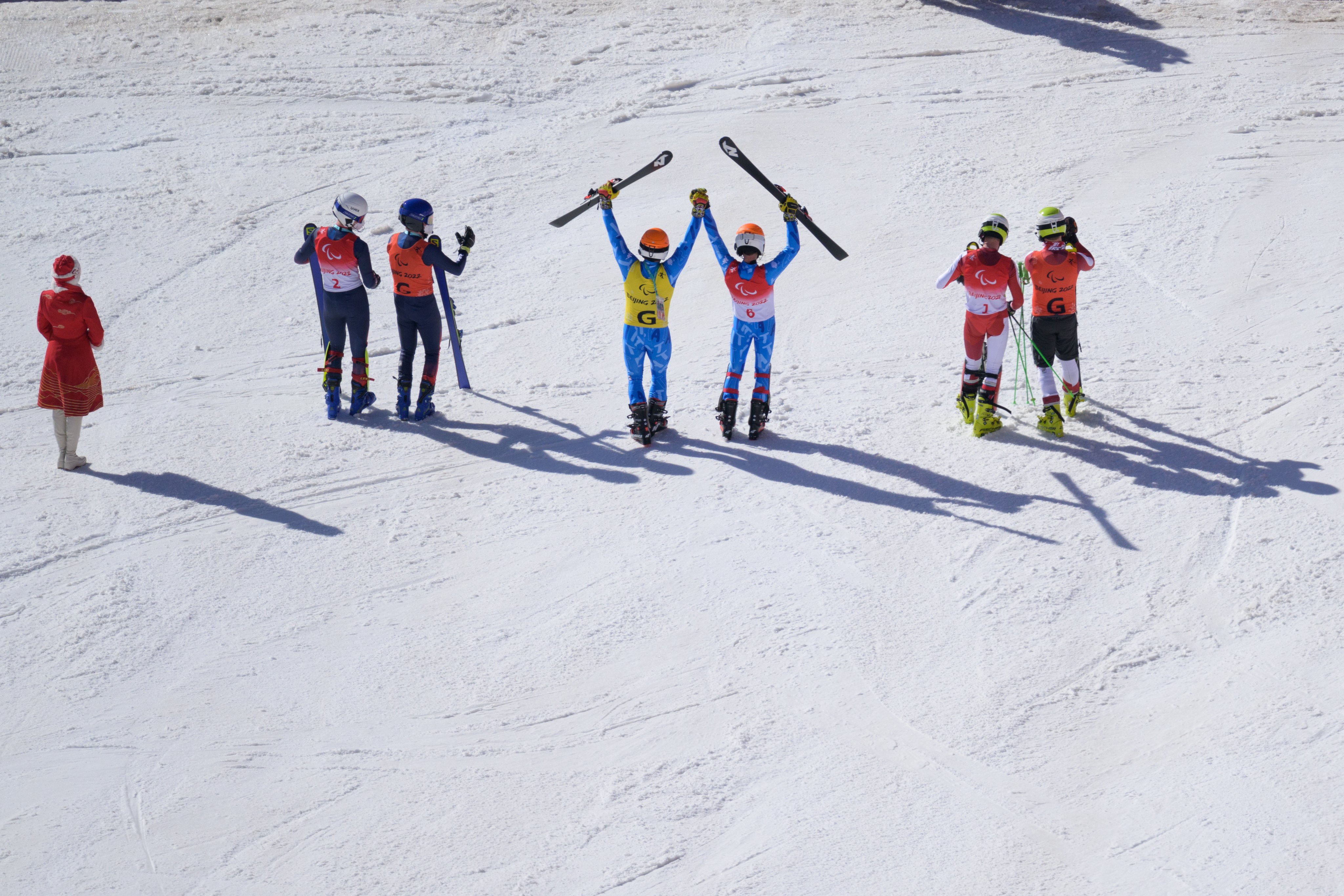 Gold medallist Giacomo Bertagnolli of Team Italy (C), Silver medallist Johannes Aigner of Team Austria (R) and Bronze medallist Neil Simpson of Team Great Britain (L) pose after competing in the Para Alpine Skiing Men's Super Combined Slalom Vision Impaired.