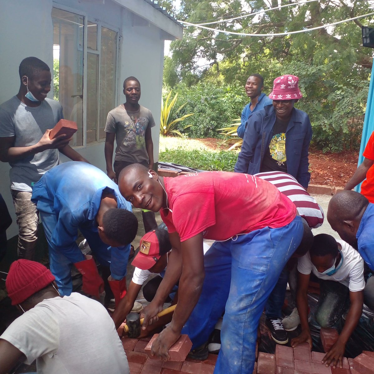 YoungAfricaInt's tweet photo. Young Africa is all about learning-by-doing. And we walk the talk: @YoungAfricaZimbabwe students enjoy a hands-on lesson on paving at the Young Africa International Hub. Bricks donated by @BetaHoldings
#youth #skills #training #competencebasedlearning #CSR https://t.co/1rg8Zum1Km