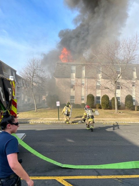 Police and firefighters catch baby thrown from second floor by Dad  escaping the fire.